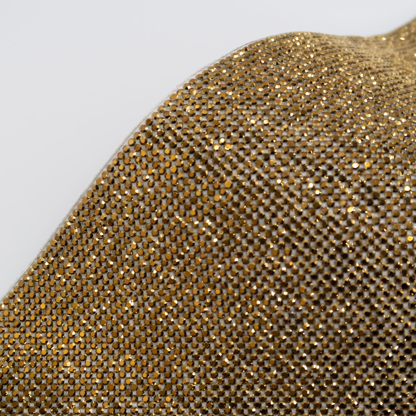 Close up of antique gold (dark gold) coloured rhinestones