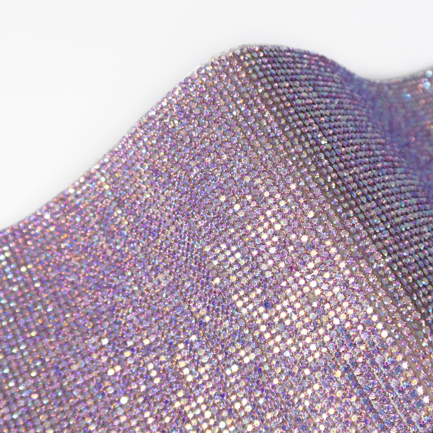 Close up of lilac coloured rhinestones with a shimmer effect