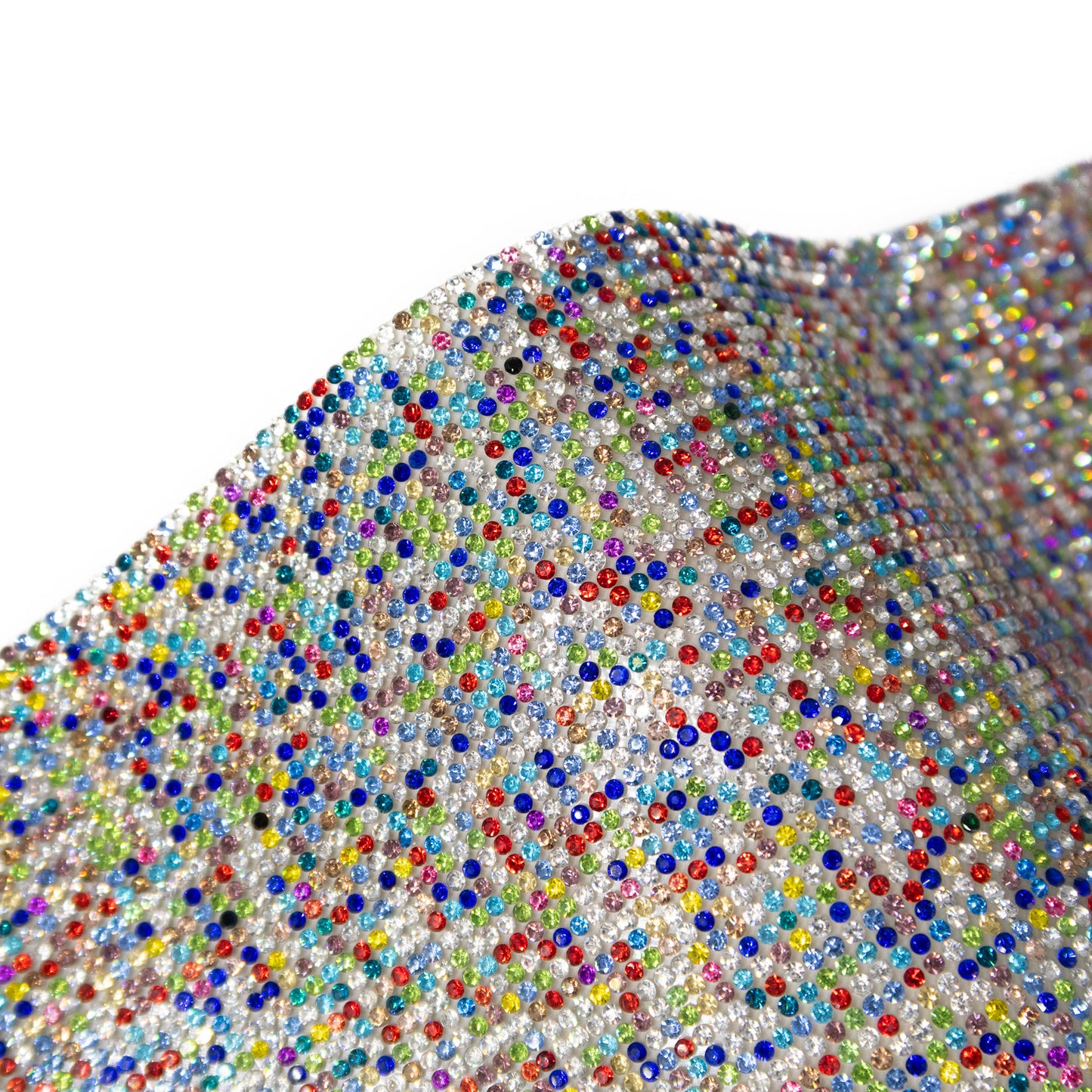 Close up of the multicoloured rhinestones used in the confetti walking stick. The rhinestones are in a random pattern of different colours including red, green, blue, yellow and pink.