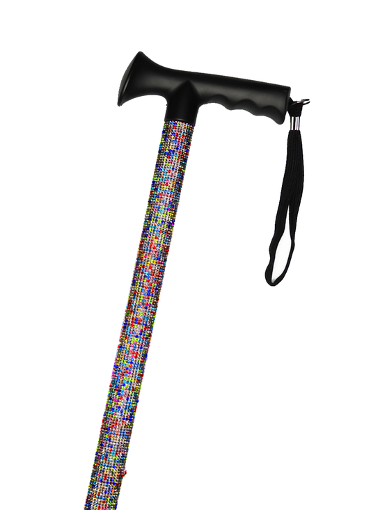 Walking stick with a black handle and black strap decorated with multi-coloured glass rhinestones.  The rhinestones are in a random pattern and include red, blue, pink, green and yellow.