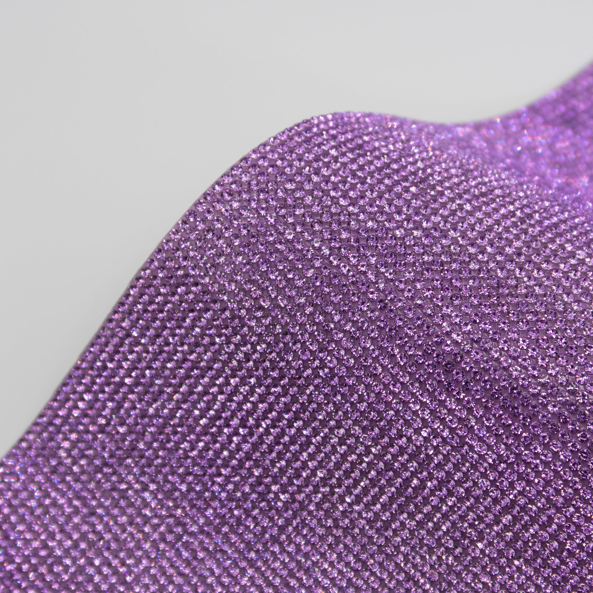 Close up of purple coloured rhinestones