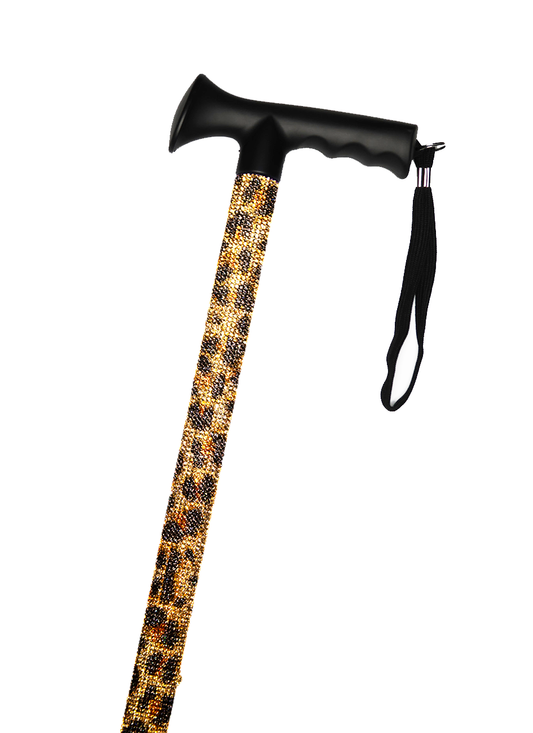 Walking stick with a black handle and black strap decorated with coloured glass rhinestones in a black and brown leopard print pattern